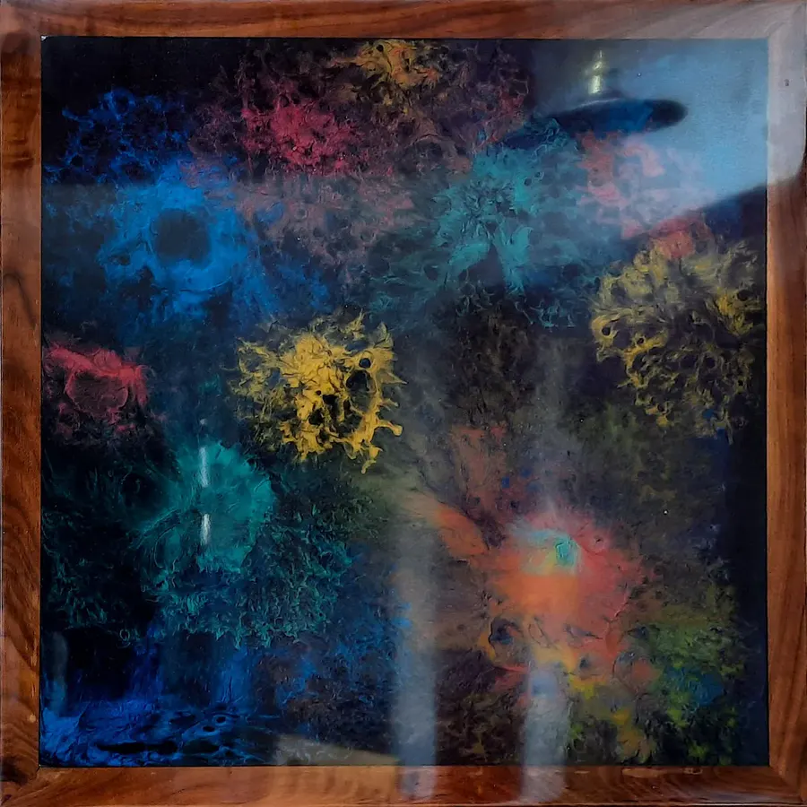 Black resin art in a walnut frame: Black with colourful accents, solid walnut frame
